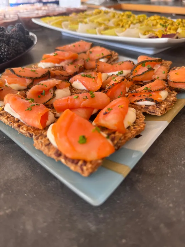 Smoked-salmon canapes on seeded crisps, plated for passing
