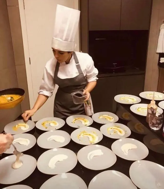 Tagliatelle and filet plated on a blue-rimmed plate